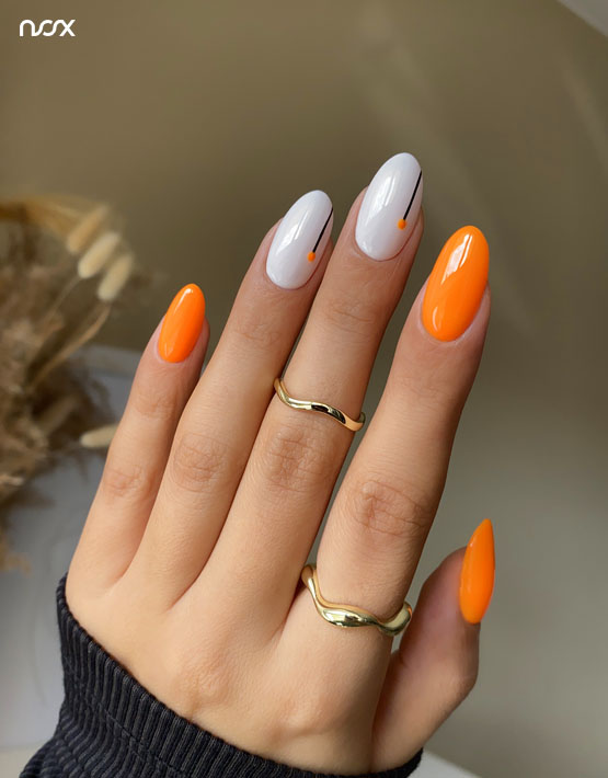 Neonowe pomarańczowe paznokcie z wzorkami